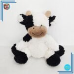 Vache en peluche noire et blanche