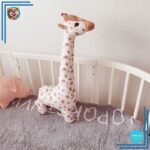 Peluche girafe câline