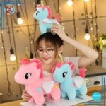 Peluche licorne bleue de corne dorée