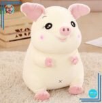 Grosse peluche cochon attachant