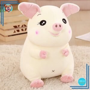 Grosse peluche cochon attachant