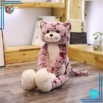 Peluche chat rose aux longues jambes