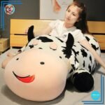 Peluche vache allongée
