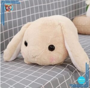 Peluche lapin beige couché