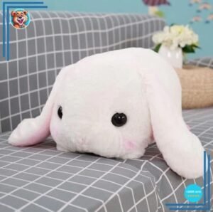 Peluche lapin blanc couché