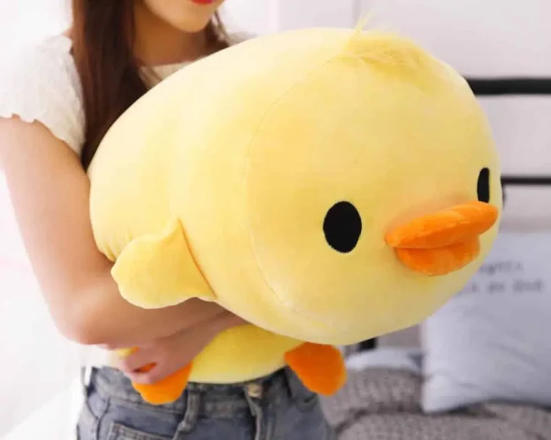 Peluche oreiller canard couché