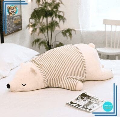 Peluche ours blanc habillé qui dort