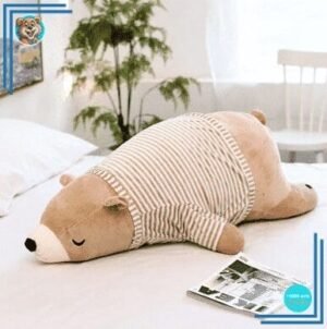 Peluche ours marron habillé qui dort