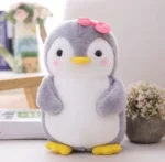Peluche pingouin nœud rose