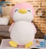 Peluche pingouin rose souriant