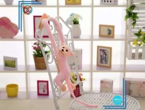 Peluche singe kawaii longue queue rose