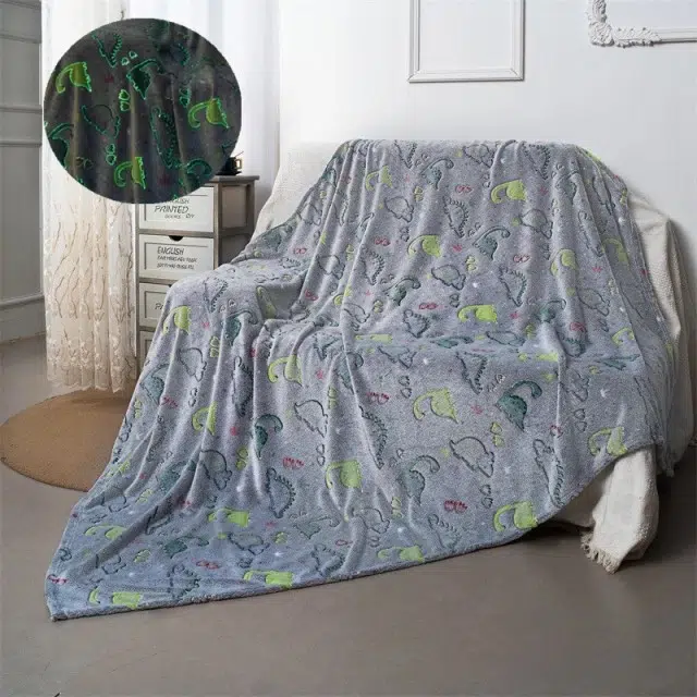 Plaid lumineux en forme de dinosaure