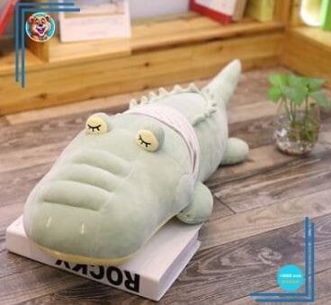 Douce peluche crocodile aux grands yeux
